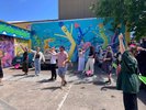 People with hands posed in a line holding kites