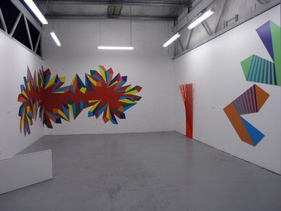 spirally shapes bright and primary colours mostly taking up wall