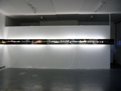 lit images across a wall