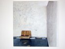 textured yellow seat in a textured grey wash room
