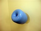 blue circular holder against yellow wall