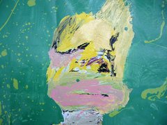 green yellow squished paint, almost like a face
