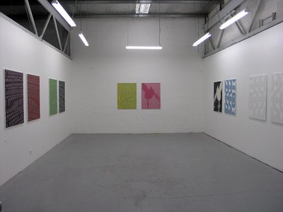 patterns on wall, colours on two sides of the room. Neatly hung