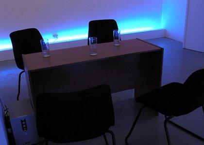 desk and office chairs, blue glow in background