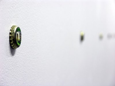 close up bottle cap on wall