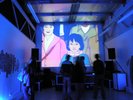 projection screen with people illustrated and purple glow