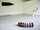 objects in situ, spirally one in forefront, pipes and tent shape in back