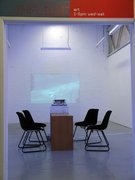 desk and surrounding office chairs. Gallery is aglow