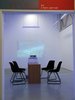 desk and surrounding office chairs. Gallery is aglow