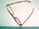 glasses in red and made up from materials, large on the wall