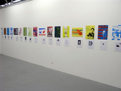 wall, plenty of yellow and blue posters