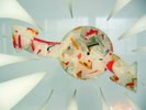 colourful lolly white / red / orange speckled object