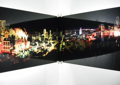 cityscape fracturing and meeting on a wall