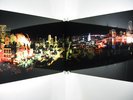 cityscape fracturing and meeting on a wall