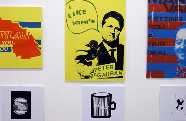 yellow and blue and red posters with faces