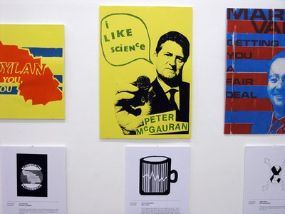 yellow and blue and red posters with faces