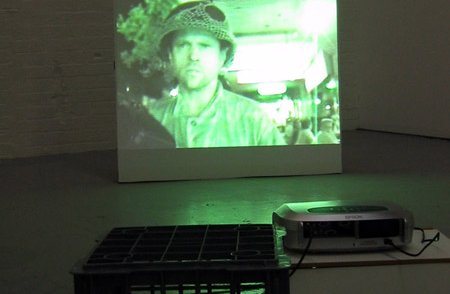 image of person in hat on projection screen on floor