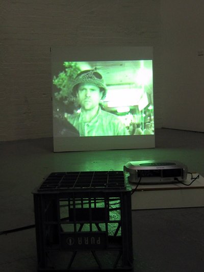 image of person in hat on projection screen on floor